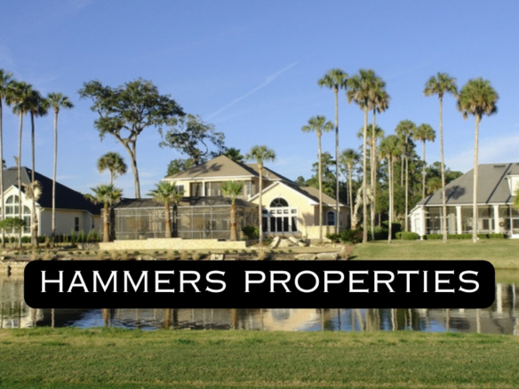 Golf course homes on a lake in Boca Raton with Hammers Properties logo