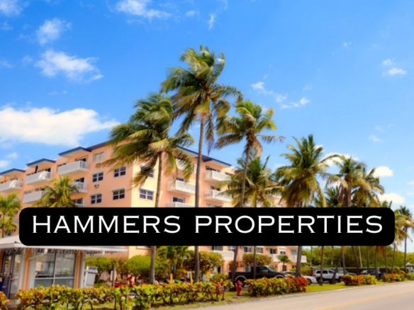 South Florida condo building with palm trees and Hammers Properties logo
