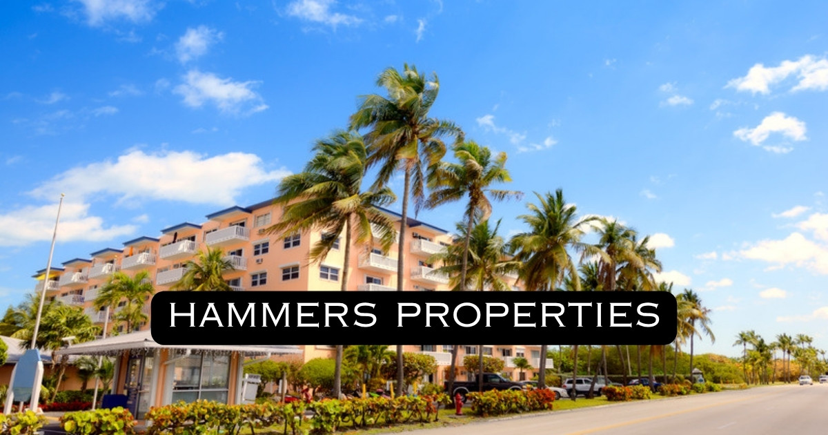 South Florida condo building with palm trees and Hammers Properties logo